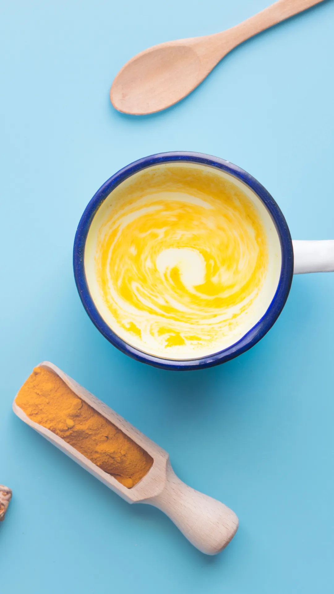 turmeric coconut coffee in the vintage glass with blue background